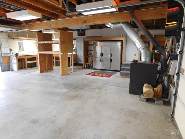garage featuring a workshop area and electric panel