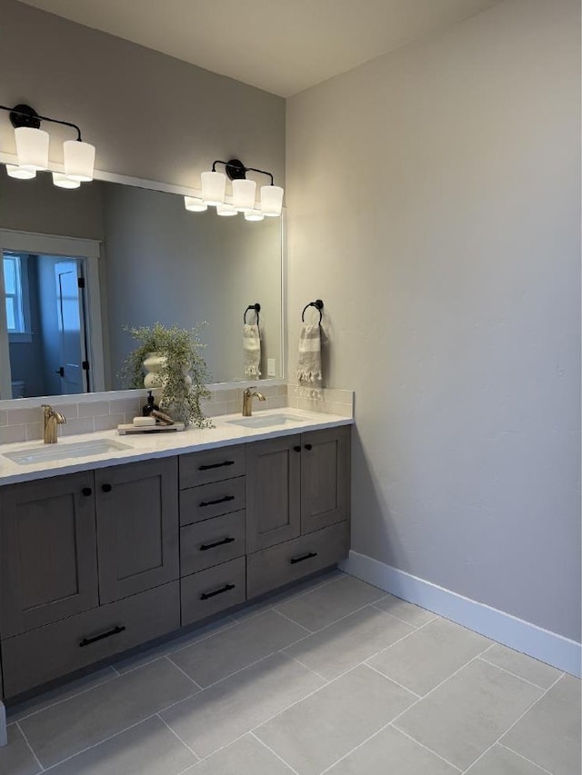 6671 W Mattawa Dr, Meridian, ID 83646 - bathroom with double vanity, tasteful backsplash, and tile patterned flooring