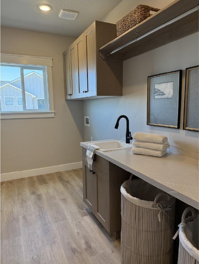 6671 W Mattawa Dr, Meridian, ID 83646 - laundry room featuring cabinet space, light wood finished floors, washer hookup, and recessed lighting