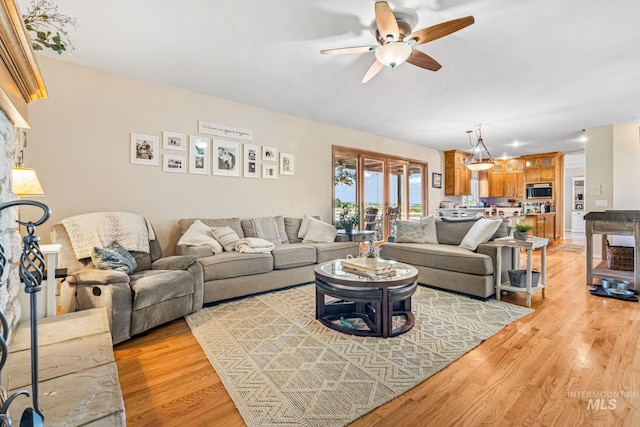 4459 E Deer Flt, Kuna, ID 83634 - living room with a ceiling fan and light wood-style flooring