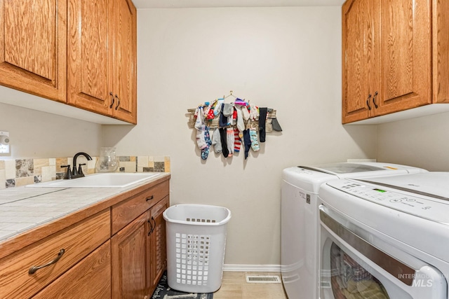 4459 E Deer Flt, Kuna, ID 83634 - laundry room with washing machine and dryer and cabinet space