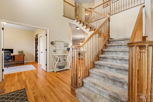 4459 E Deer Flt, Kuna, ID 83634 - stairway with wood finished floors and a towering ceiling