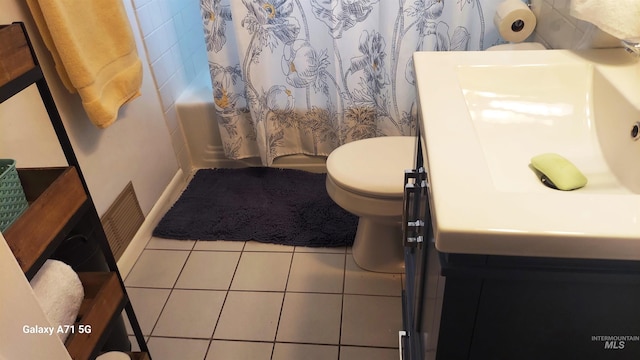 bathroom featuring tile patterned flooring, visible vents, toilet, and vanity