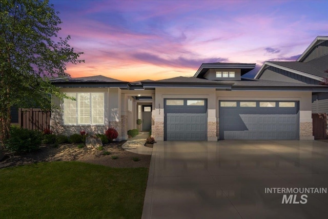 4772 W Barnview Dr, Boise, ID 83614 - view of front facade featuring a garage, concrete driveway, stone siding, and stucco siding