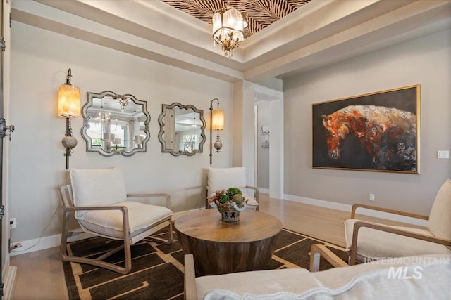 4772 W Barnview Dr, Boise, ID 83614 - sitting room featuring a chandelier, wood finished floors, and a raised ceiling