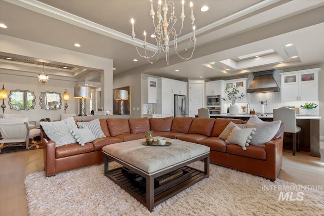 4772 W Barnview Dr, Boise, ID 83614 - living area featuring a raised ceiling, a chandelier, recessed lighting, and ornamental molding