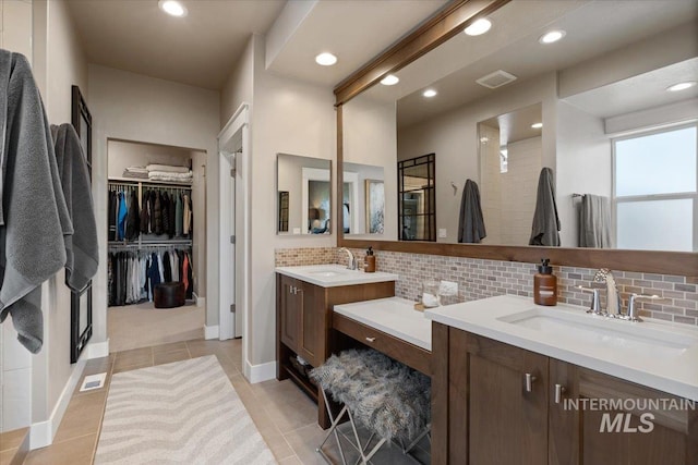 4772 W Barnview Dr, Boise, ID 83614 - full bath featuring tasteful backsplash, two vanities, recessed lighting, a walk in closet, and tile patterned flooring