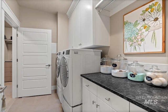 4772 W Barnview Dr, Boise, ID 83614 - washroom featuring washing machine and clothes dryer, light tile patterned floors, and cabinet space