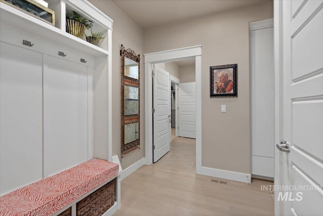 4772 W Barnview Dr, Boise, ID 83614 - mudroom with baseboards and light wood-type flooring
