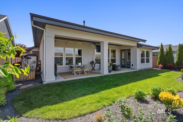 4772 W Barnview Dr, Boise, ID 83614 - back of house featuring stucco siding, a patio area, and ceiling fan