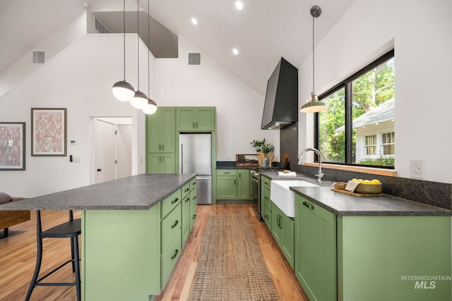 1435 N Garden, Boise, ID 83706 - kitchen featuring green cabinets, a sink, appliances with stainless steel finishes, wall chimney exhaust hood, and dark countertops