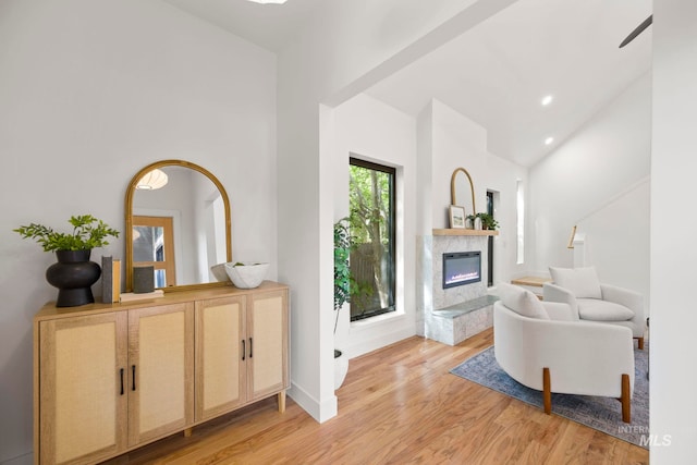 1435 N Garden, Boise, ID 83706 - living room featuring high vaulted ceiling, light wood finished floors, a high end fireplace, baseboards, and recessed lighting