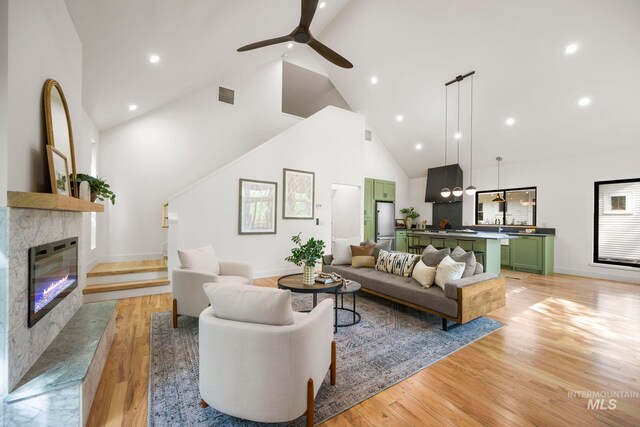 1435 N Garden, Boise, ID 83706 - living area with high vaulted ceiling, light wood-style flooring, ceiling fan, baseboards, and recessed lighting