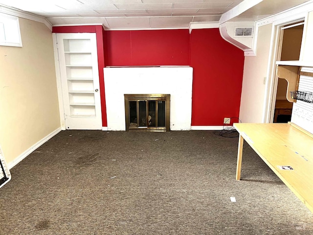 unfurnished living room with carpet and ornamental molding