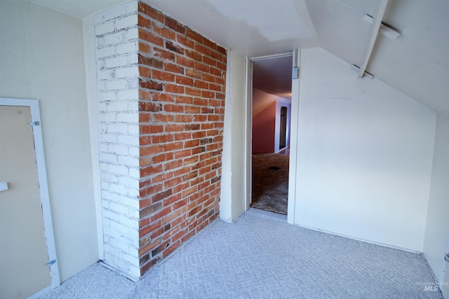 additional living space with carpet and vaulted ceiling