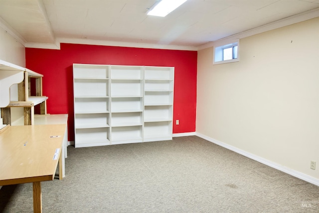 unfurnished office featuring crown molding and carpet