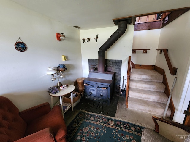 4942 E Baumgartner Rd, Featherville, ID 83647 - staircase with a wood stove and concrete floors