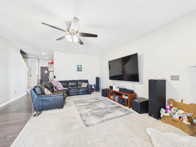 living room featuring baseboards, ceiling fan, stairs, recessed lighting, and wood finished floors