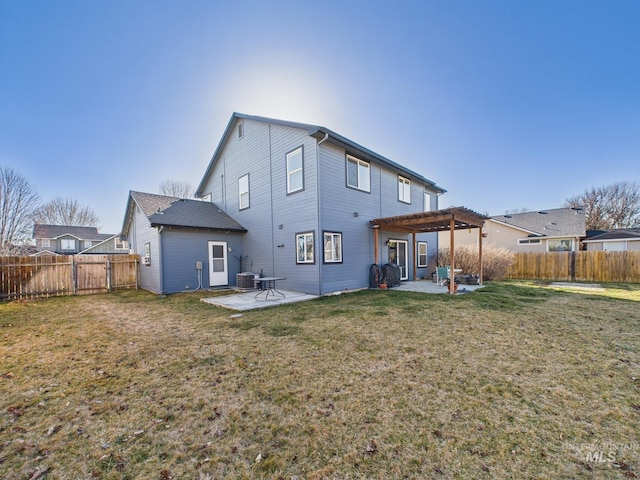 rear view of property with a yard, a patio, a fenced backyard, and a pergola