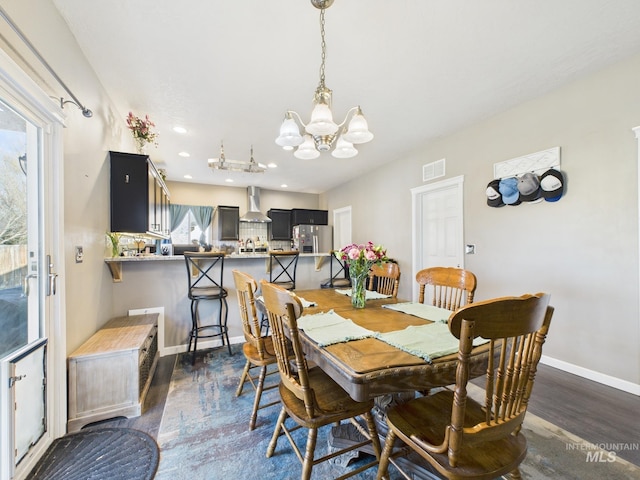 dining space featuring visible vents, baseboards, dark wood finished floors, a chandelier, and recessed lighting