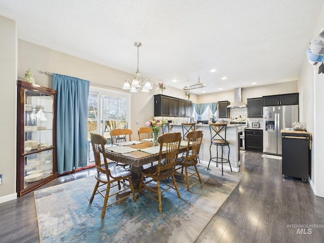 dining room featuring recessed lighting, baseboards, dark wood-type flooring, and an inviting chandelier