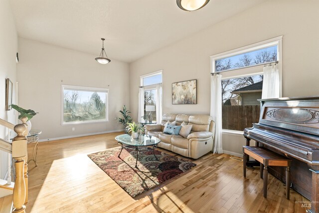 living area with wood finished floors and baseboards