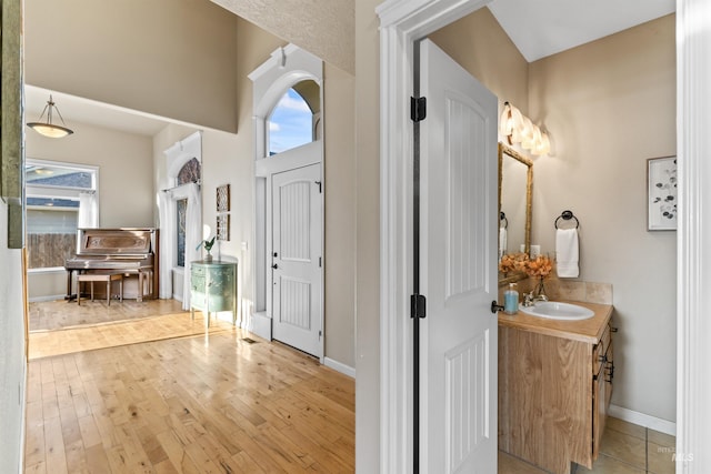 entrance foyer featuring wood finished floors and baseboards