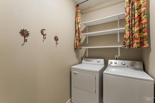 laundry room featuring washing machine and clothes dryer