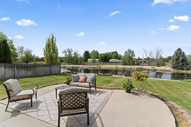 view of patio / terrace featuring a water view and outdoor lounge area