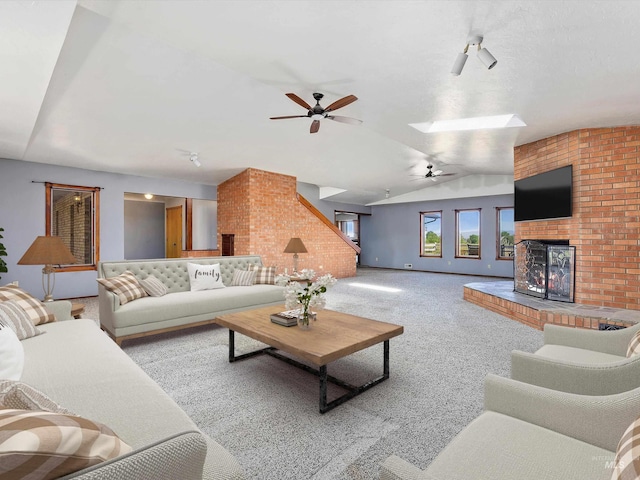 1872 E 1750 S, Gooding, ID 83330 - living room featuring lofted ceiling, carpet, a ceiling fan, and a brick fireplace