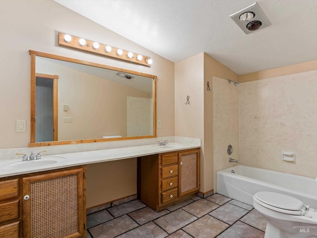 1872 E 1750 S, Gooding, ID 83330 - bathroom featuring double vanity, toilet, lofted ceiling, and washtub / shower combination