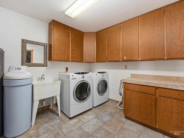 1872 E 1750 S, Gooding, ID 83330 - washroom with cabinet space, washing machine and dryer, and light stone finish floors