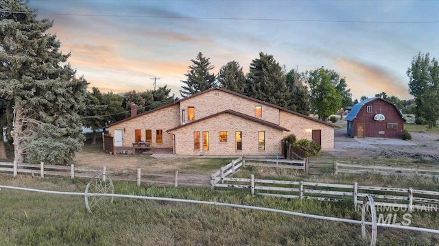1872 E 1750 S, Gooding, ID 83330 - view of front facade featuring a barn, a chimney, and an outdoor structure