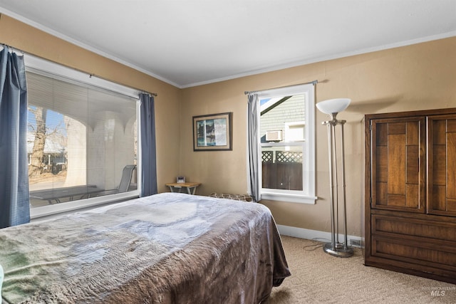 bedroom with baseboards, ornamental molding, and light colored carpet