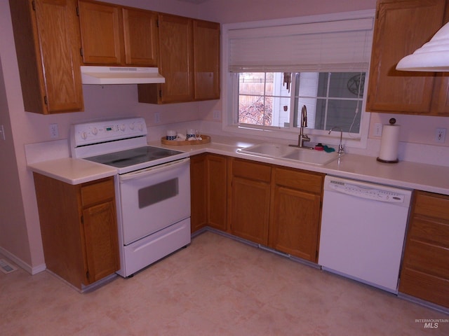 kitchen with sink and white appliances