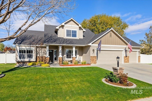 605 W Highland Ave, Nampa, ID 83686 - craftsman house with fence, an attached garage, concrete driveway, and a front lawn