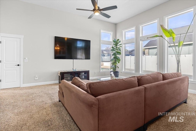 605 W Highland Ave, Nampa, ID 83686 - living room featuring baseboards, ceiling fan, and carpet