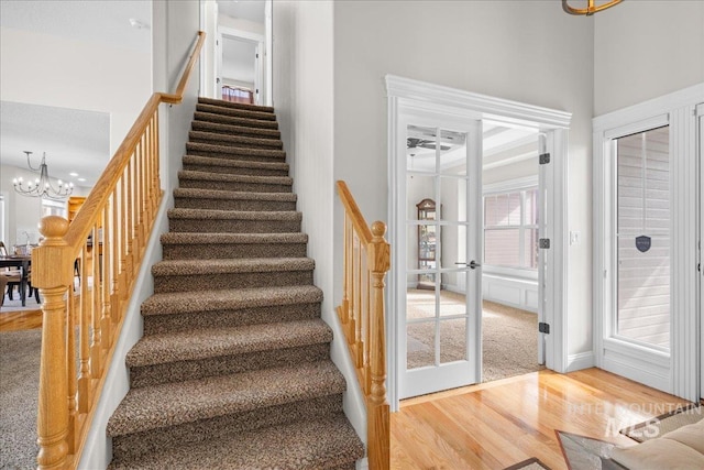 605 W Highland Ave, Nampa, ID 83686 - stairway featuring wood finished floors and a notable chandelier