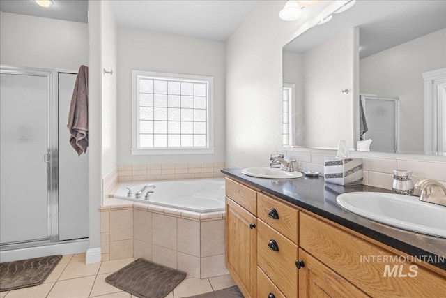 605 W Highland Ave, Nampa, ID 83686 - bathroom featuring a sink, tile patterned flooring, and a stall shower