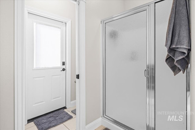 605 W Highland Ave, Nampa, ID 83686 - full bathroom featuring tile patterned floors, baseboards, and a stall shower