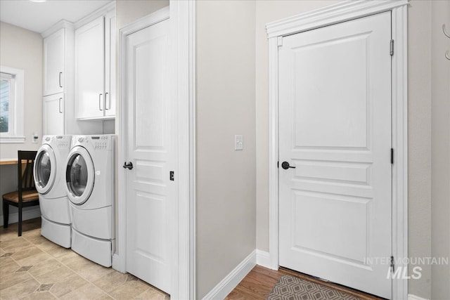 605 W Highland Ave, Nampa, ID 83686 - laundry room with baseboards, washing machine and dryer, and cabinet space