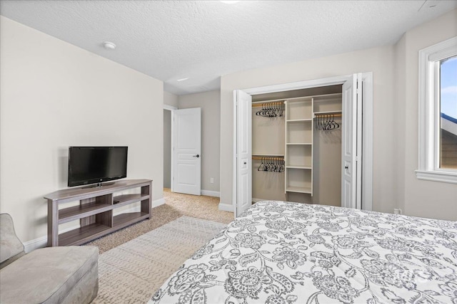 605 W Highland Ave, Nampa, ID 83686 - carpeted bedroom with baseboards, a textured ceiling, and a closet