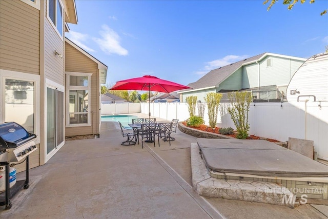 605 W Highland Ave, Nampa, ID 83686 - view of patio / terrace with a fenced in pool, a fenced backyard, outdoor dining space, and area for grilling