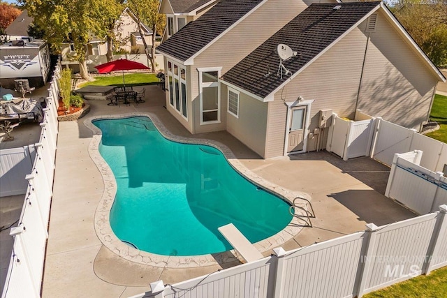 605 W Highland Ave, Nampa, ID 83686 - view of swimming pool featuring a fenced in pool, a gate, a fenced backyard, and a patio area