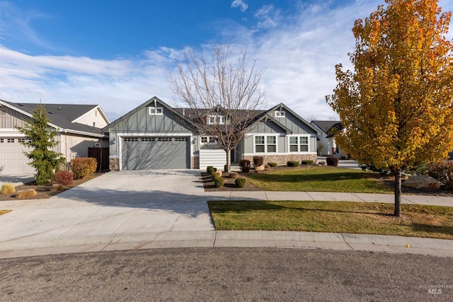 view of front facade with a garage and a front lawn