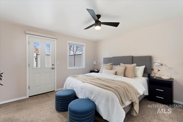 bedroom with ceiling fan, carpet, and baseboards