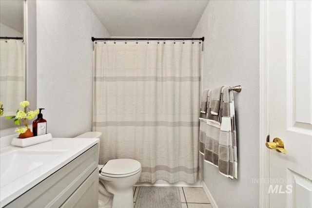 full bath featuring toilet, tile patterned floors, a shower with shower curtain, and vanity