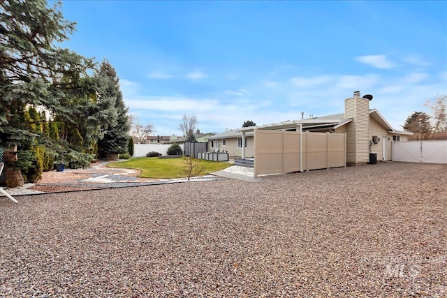 view of yard with a gate and fence