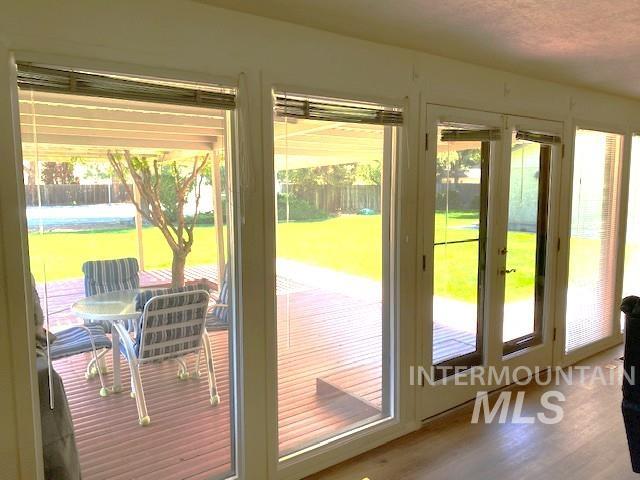 doorway to outside with wood finished floors