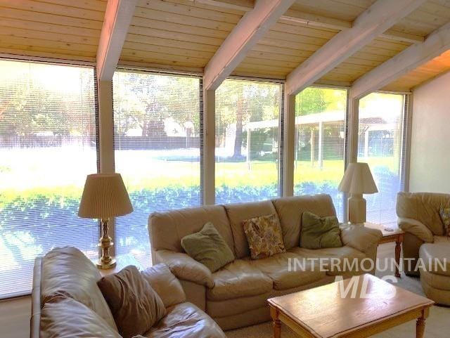 sunroom featuring wood ceiling